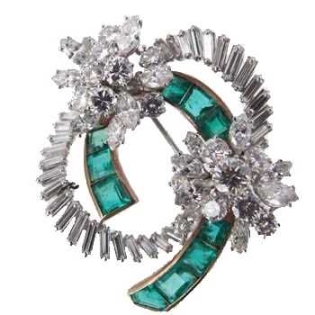 Lot 275 - An emerald and diamond floral brooch by Garrard & Co