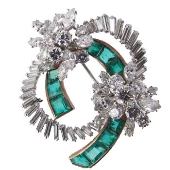 Lot 275 - An emerald and diamond floral brooch by Garrard & Co