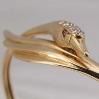 Lot 334 - Boodles swan bangle 18ct gold and diamond