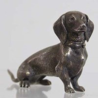 Lot 193 - Cast silver dachshund.