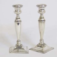 Lot 203 - Pair of filled silver candlesticks