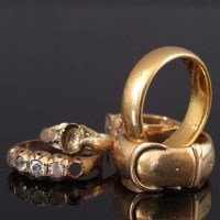 Lot 216 - 22ct gold band; 18ct gold ring; three odd rings