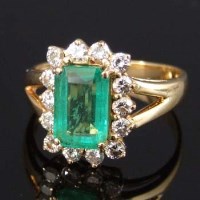 Lot 263 - Emerald and diamond emerald-cut ring.