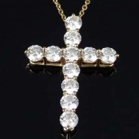 Lot 301 - Tiffany 18ct gold and diamond cross pendant