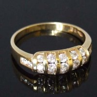 Lot 303 - 18ct yellow gold and diamond ring, the half hoop