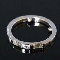 Lot 308 - Platinum and diamond ring, the baguettes