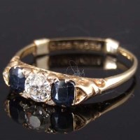 Lot 334 - Sapphire and diamond three-stone ring