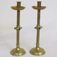 Lot 369 - Pair of cast brass and hard stone Puginesque candlesticks, late 19th century.