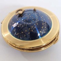 Lot 399 - Kigu flying saucer compact.