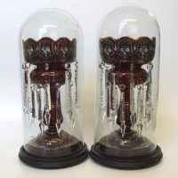 Lot 500 - Pair late 19th century ruby glass lustres with domes.