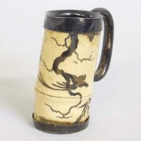 Lot 509 - Ivory and silver mounted jug.