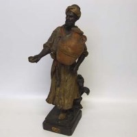 Lot 573 - Goldscheider figure of a moor water carrier.