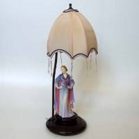 Lot 620 - Royal Doulton cloth hide figure lamp base.