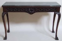 Lot 665 - Carved mahogany serving table with a green marble