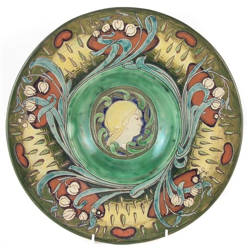 Lot 181 - Della Robbia charger, incised by Cassandra Annie Walker with a portrait of a lady within floral border with art nouveau curves, base dated 1900, 35cm diameter Condition report: No restoration. Mino...