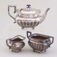 Lot 230 - Silver three piece tea set.