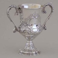 Lot 232 - Victorian embossed silver trophy.