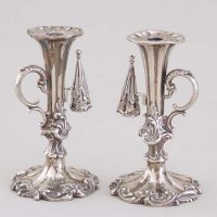 Lot 240 - Pair of silver candlesticks each with handle and