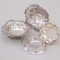 Lot 248 - Pair of silver bonbon dishes; foliate small bowl