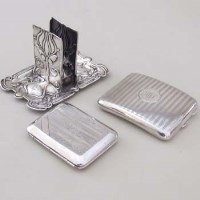 Lot 270 - Two silver cigarette cases and a match box