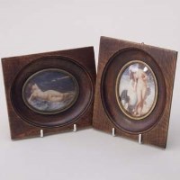 Lot 274 - Two Art Nouveau oval miniatures of young women.