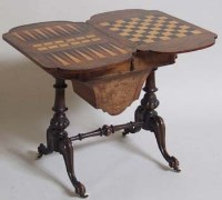 Lot 739 - Victorian walnut inlaid games table.