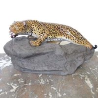 Lot 625 - Royal Doulton Leopard on rock,DB2573