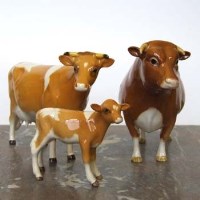 Lot 665 - Beswick Guernsey cow set