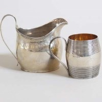 Lot 228 - Silver barrel mug and silver jug.
