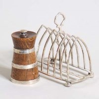 Lot 250 - Silver toast rack and silver and oak pepper mill