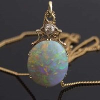 Lot 309 - Oval opal pendant on chain