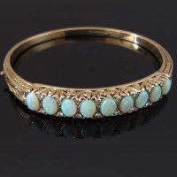 Lot 310 - Opal and diamond hinged bangle