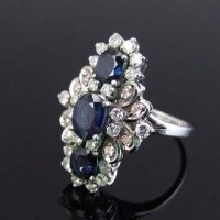 Lot 328 - Sapphire and diamond ring.