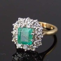 Lot 336 - 18ct gold emerald and diamond rectangular cluster