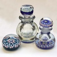 Lot 542 - Two paperweight bottles and a paperweight by John