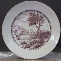 Lot 558 - Maganese Delft charger.