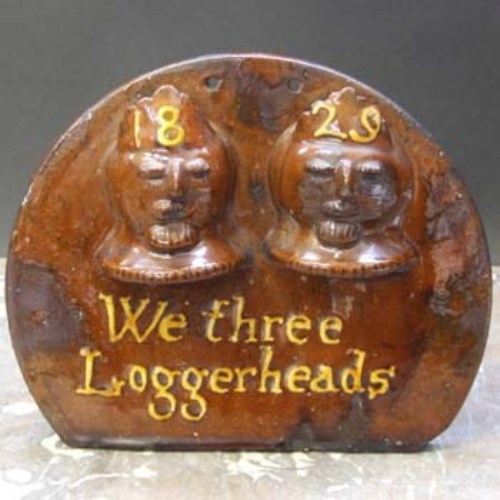 Lot 568 - 1829 loggerheads slipware plaque.