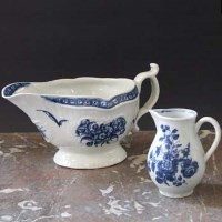 Lot 595 - Worcester strap fluted sauceboat and a cream jug