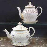 Lot 704 - Two Worcester teapots and stands by Flight and by