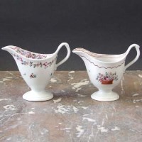 Lot 900 - Two Newhall helmet shaped cream jugs circa 1790