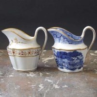 Lot 907 - Two Newhall helmet shaped cream jugs circa 1790