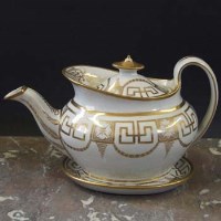 Lot 919 - Newhall teapot and stand circa 1800  painted with