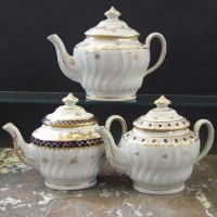 Lot 928 - Three Newhall teapots circa 1795,   painted with