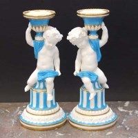 Lot 986 - Pair of Minton cherub candlesticks.