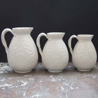 Lot 1019 - Three graduated Brownfield parian jugs circa 1867