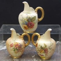 Lot 1058 - Three Royal Worcester flat back jugs