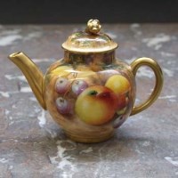 Lot 1063 - Royal Worcester miniature tea pot.