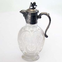 Lot 197 - Cut glass wine ewer with plated mounts.