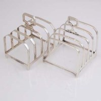 Lot 217 - Two silver toast racks