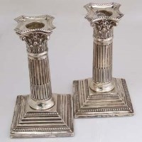 Lot 219 - Pair of silver column sticks
